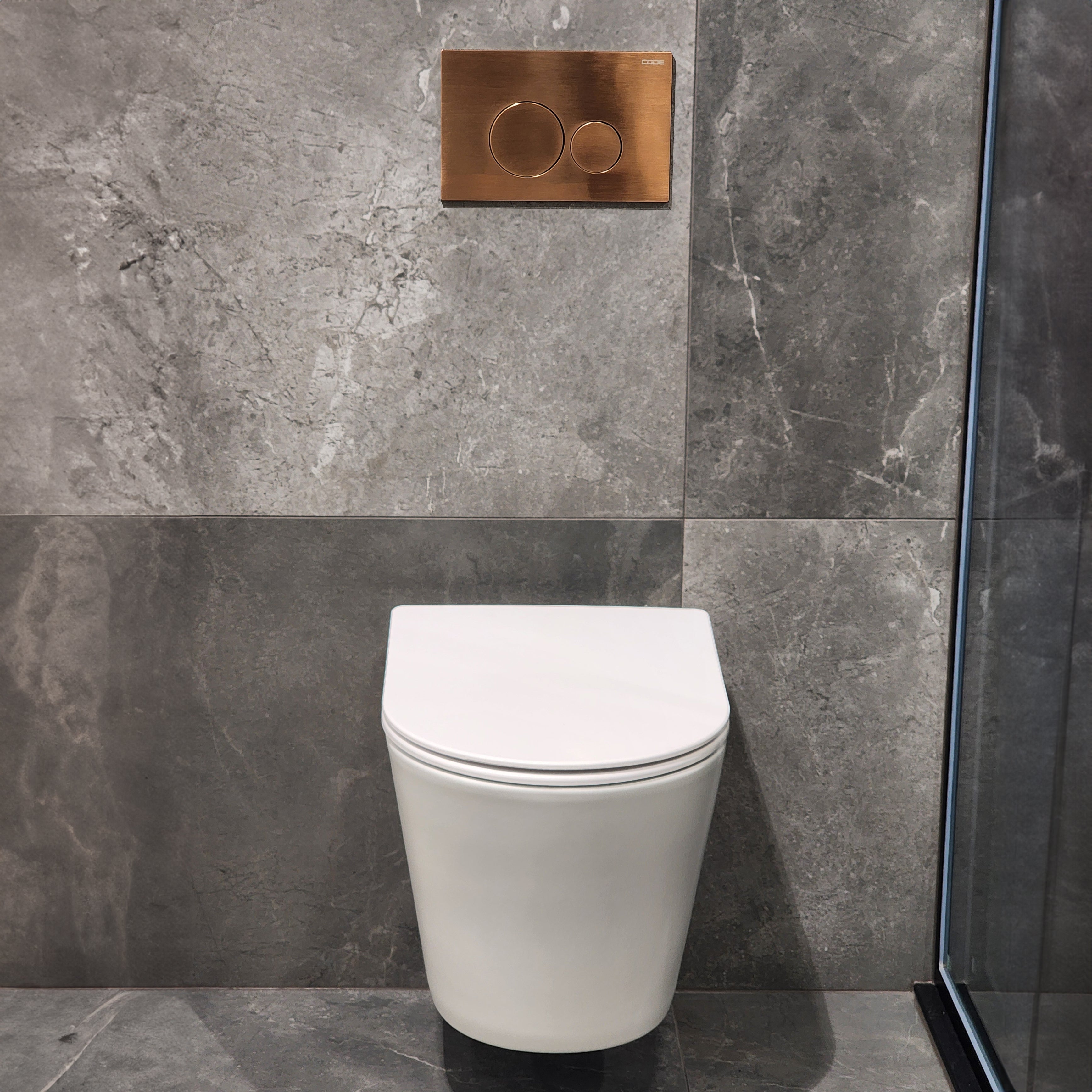 CODE PURE TYPHOON WALL HUNG TOILET SUITE | BRUSHED COPPER BUTTON