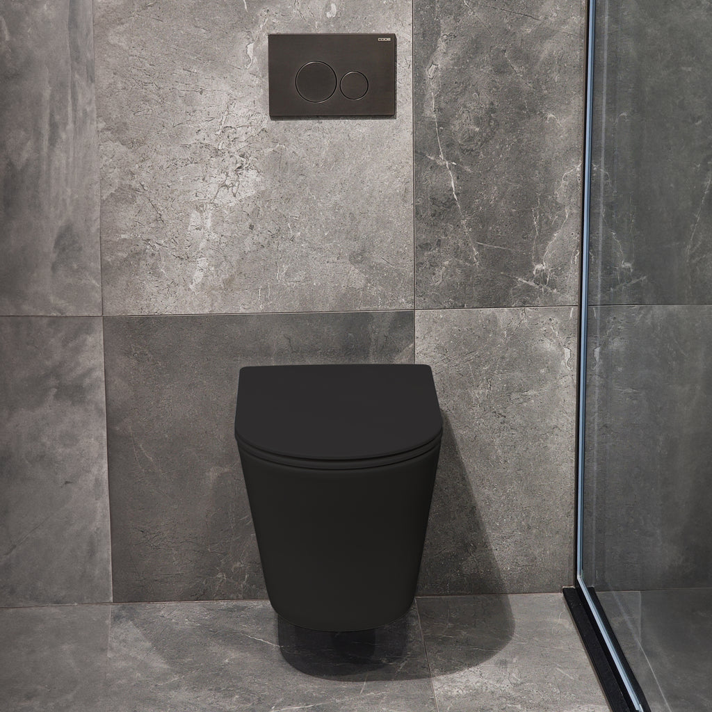 code-pure-wall-hung-toilet-suite-in-matte-black-with=-gunmetal-toilet-button-in-bathroom-tiled-setting