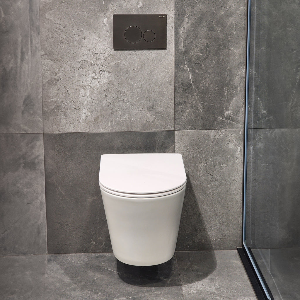 code=pure-wall-hung-toilet-suite-with=-gunmetal-toilet-button-in-bathroom-tiled-setting
