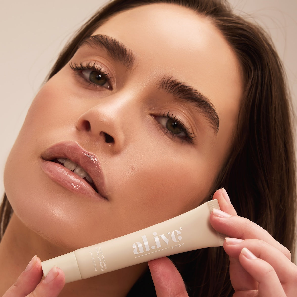 al.ive body Tinted Lip Butter Nude Coconut - swatch shot