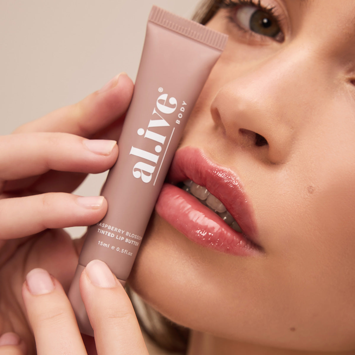 al.ive body Tinted Lip Butter Raspberry Blossom - lifestyle shot