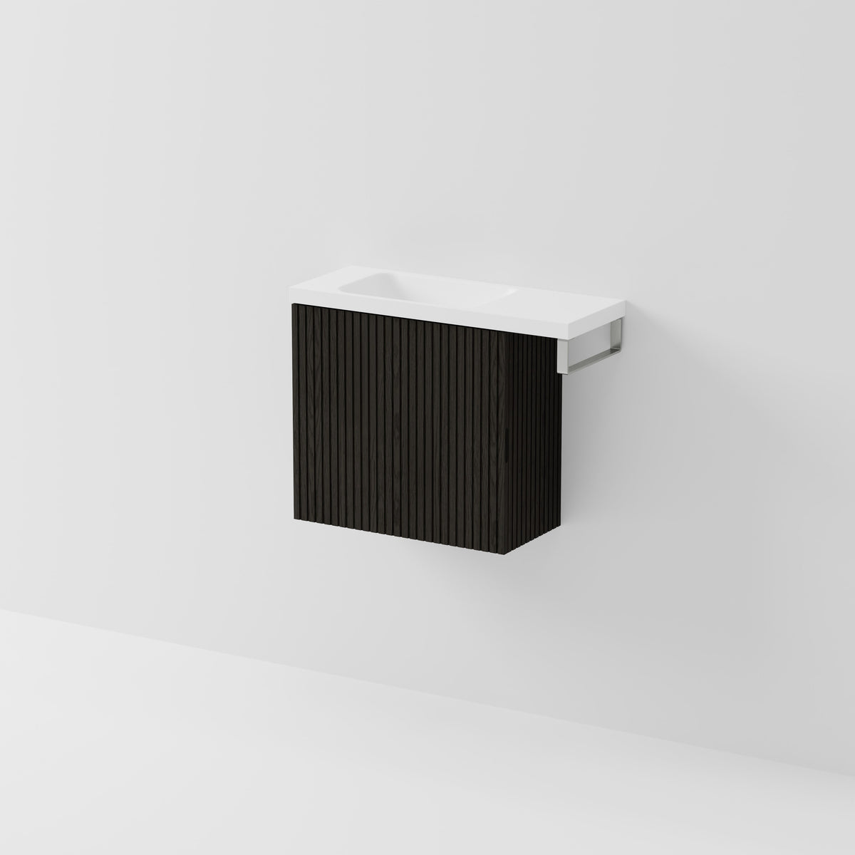 Aria 550 wall-hung WC vanity in Dark Ash timber with an offset basin and integrated Brushed Nickel hand towel rail, shown against a white background.