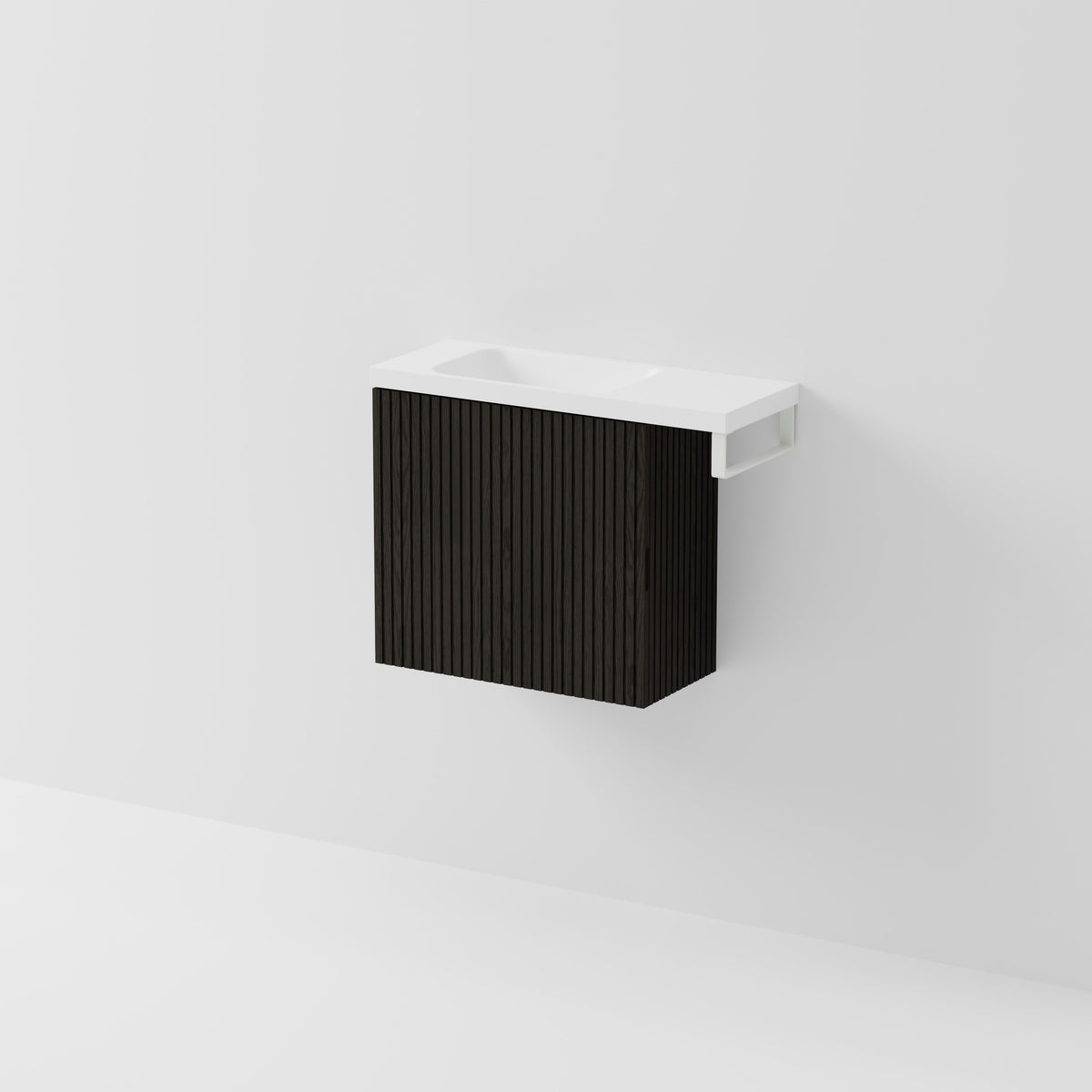 Aria 550 wall-hung WC vanity in Dark Ash timber with an offset basin and integrated Matte White hand towel rail, shown against a white background.
