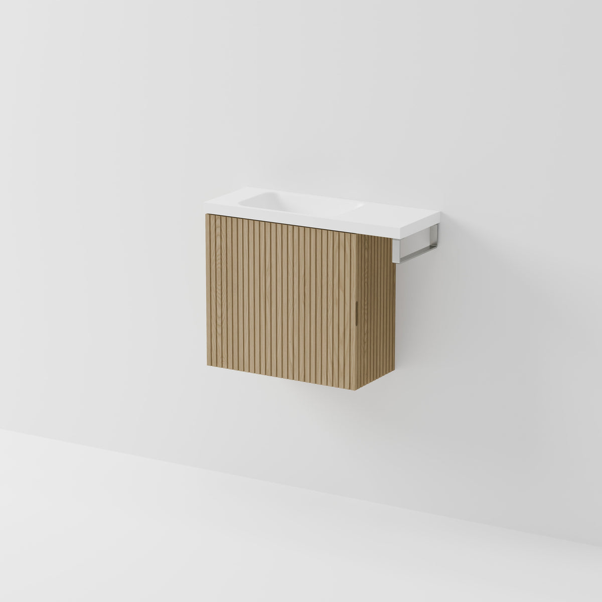 Aria 550 wall-hung WC vanity in Light Ash timber with an offset basin and integrated Brushed Nickel hand towel rail, shown against a white background.