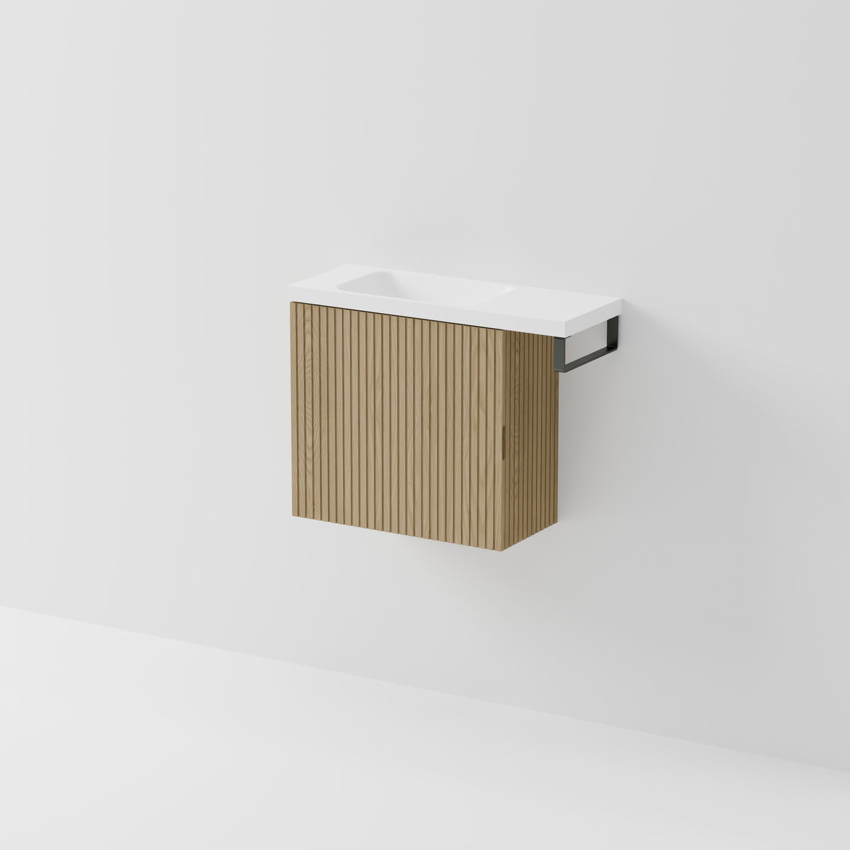 Aria 550 wall-hung WC vanity in Light Ash timber with an offset basin and integrated Gunmetal hand towel rail, shown against a white background.