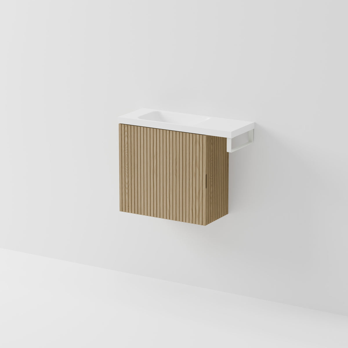 Aria 550 wall-hung WC vanity in Light Ash timber with an offset basin and integrated Matte White hand towel rail, shown against a white background.