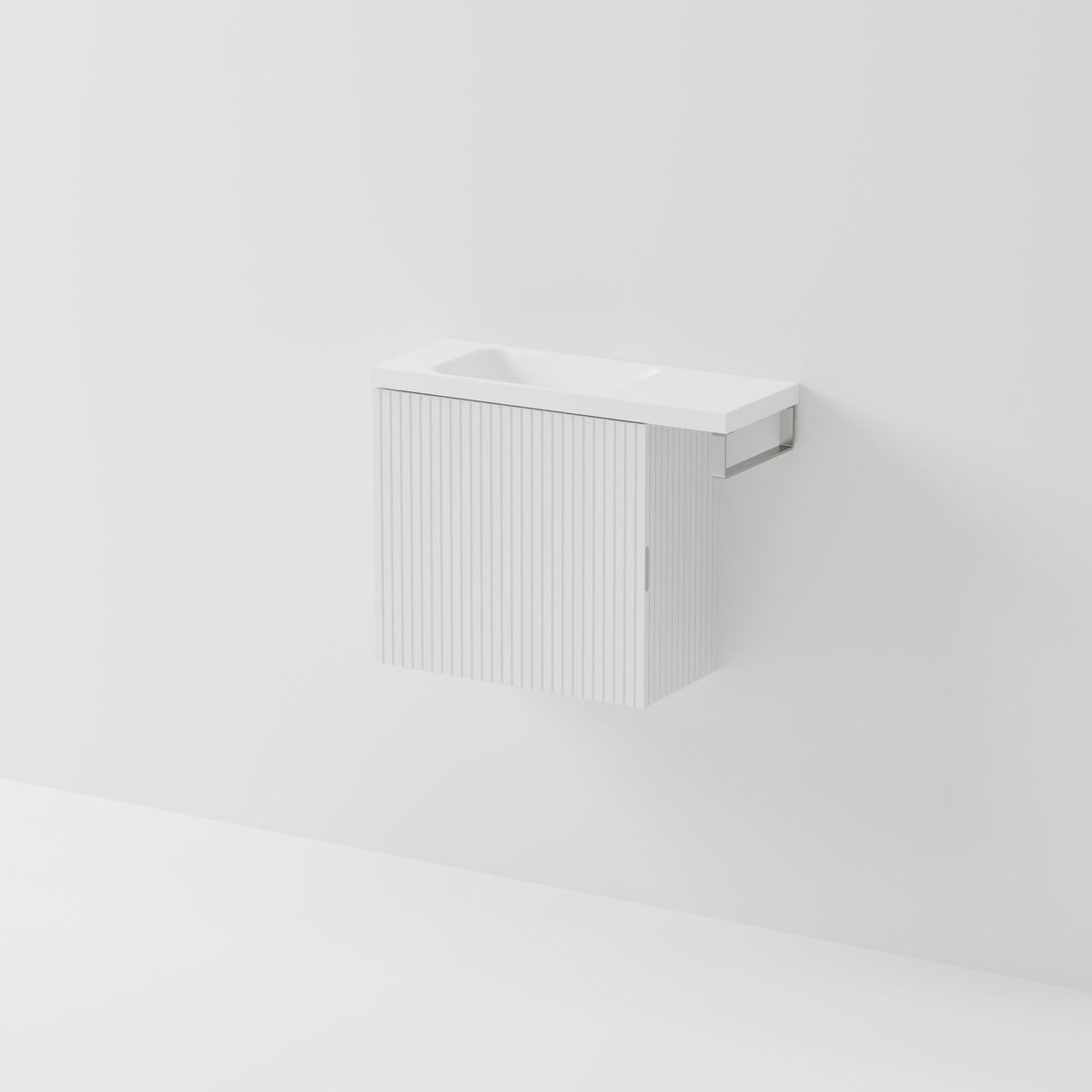 Aria 550 wall-hung WC vanity in Matte White with an offset basin and integrated Brushed Nickel hand towel rail, shown against a white background.