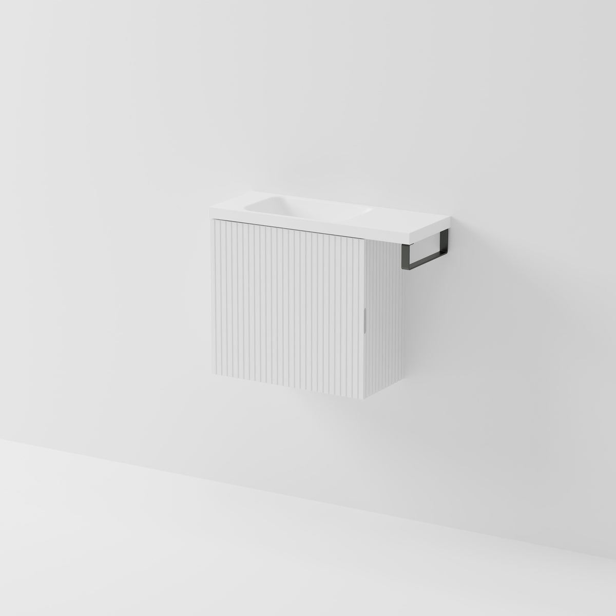Aria 550 wall-hung WC vanity in Matte White with an offset basin and integrated Gunmetal hand towel rail, shown against a white background.