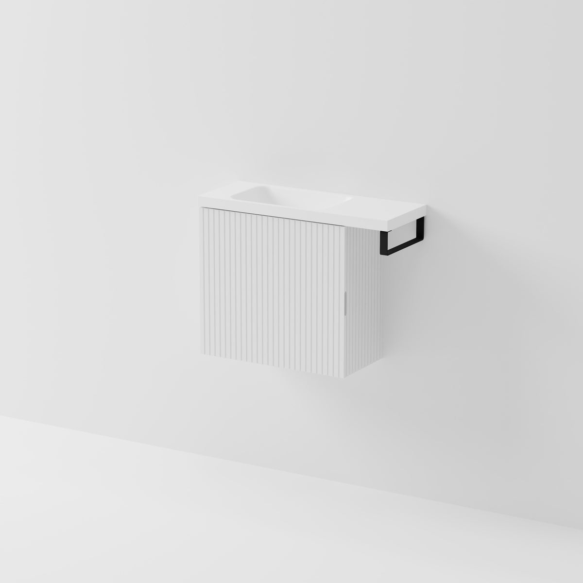 Aria 550 wall-hung WC vanity in Matte White with an offset basin and integrated Matte Black hand towel rail, shown against a white background.