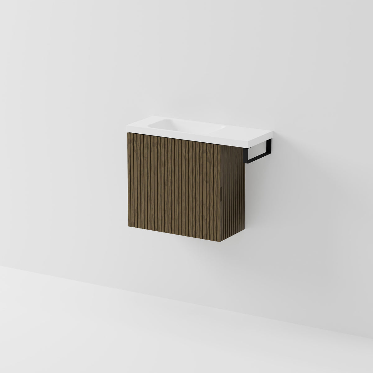 Aria 550 wall-hung WC vanity in Smoked Ash timber with an offset basin and integrated Matte Black hand towel rail, shown against a white background.