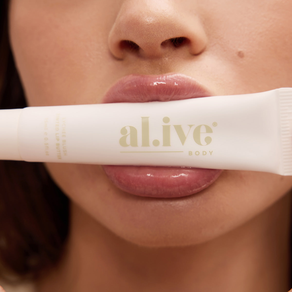 al.ive body Tinted Lip Butter Lychee Blush - lifestyle shot