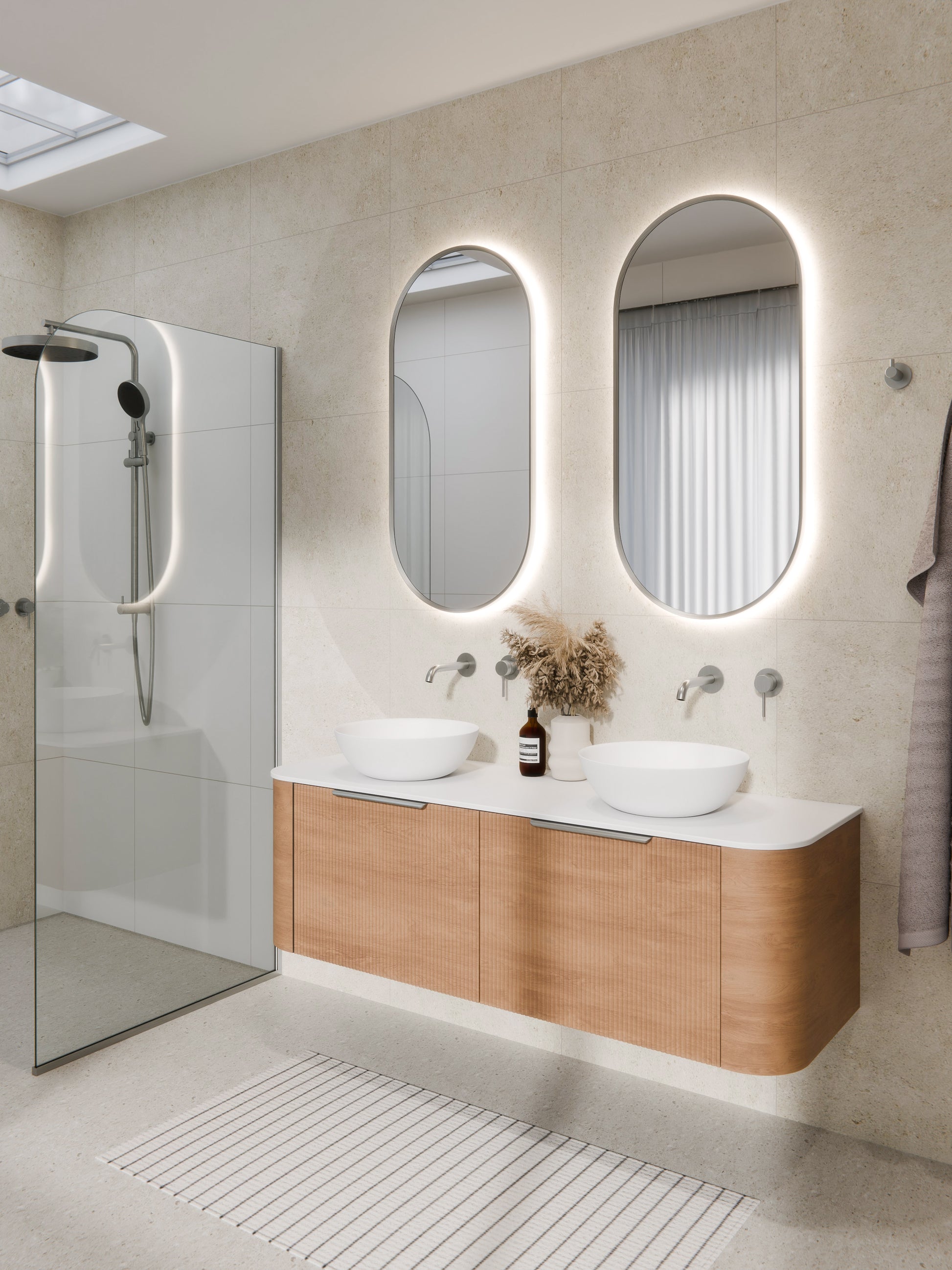 aura-framed-oval-led-mirror-in-brushed-nickel-bathroom-setting-render