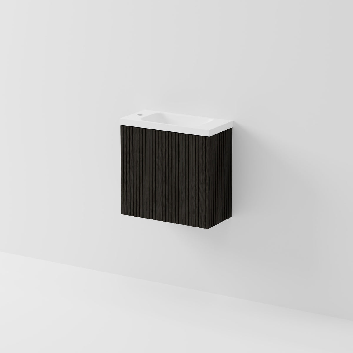 A modern wall-mounted bathroom vanity with a black ribbed cabinet and a white integrated sink basin, shown against a clean white wall.