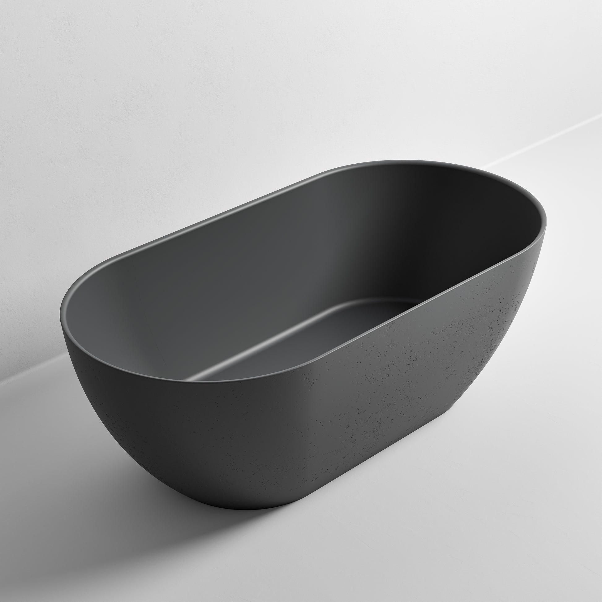 freestanding-bath-in-dark-grey-made-from-textured-solid-surface