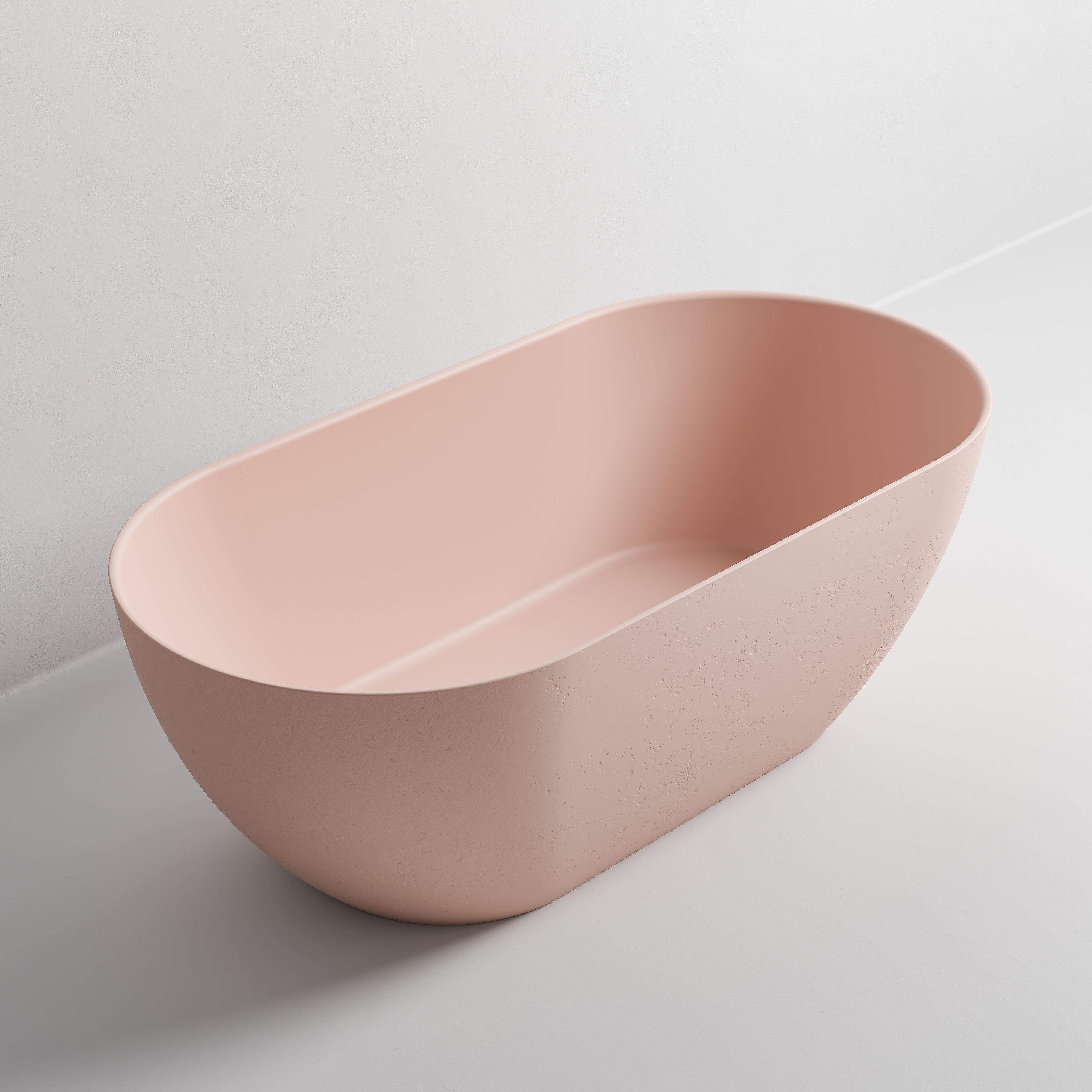 freestanding-bath-in-light-pink-made-from-textured-solid-surface