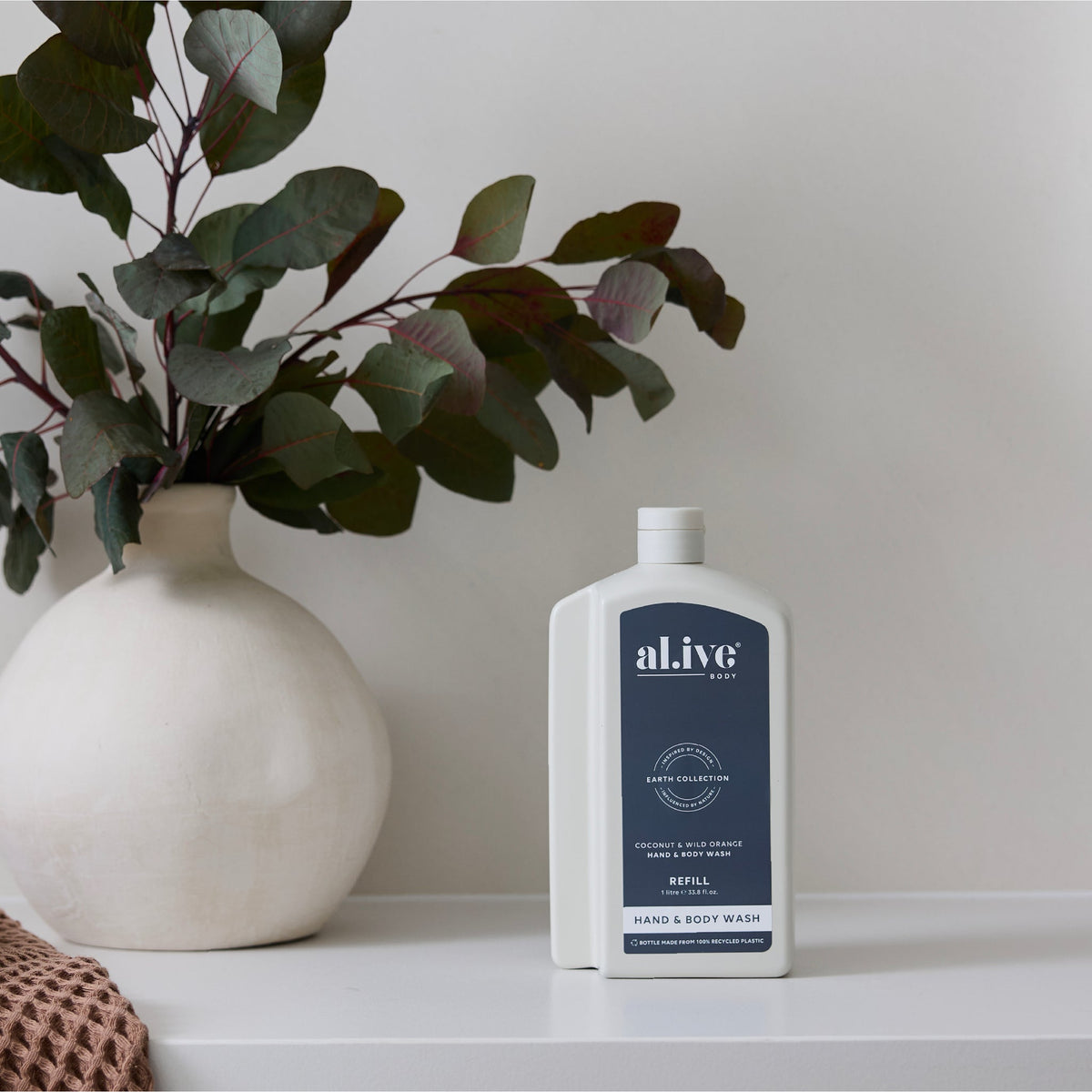al.ive body Hand & Body Wash Refill Coconut & Wild Orange - lifestyle shot