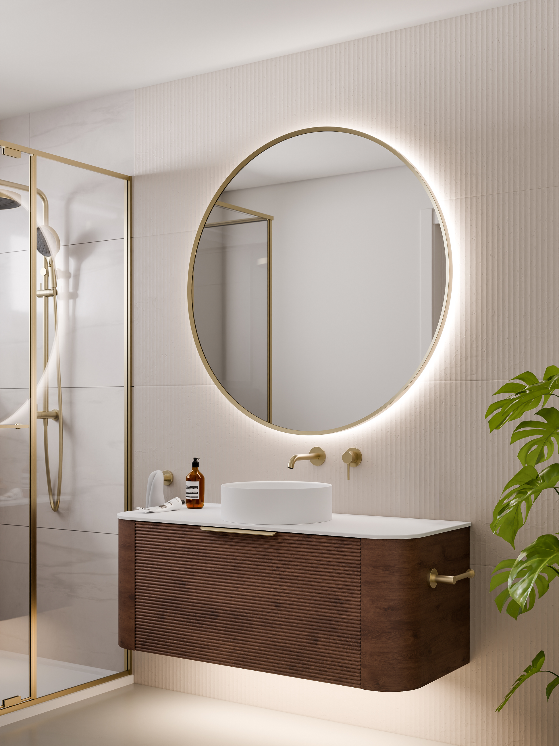 round-framed-led-mirror-in-brushed-brass-with-curved-vanity