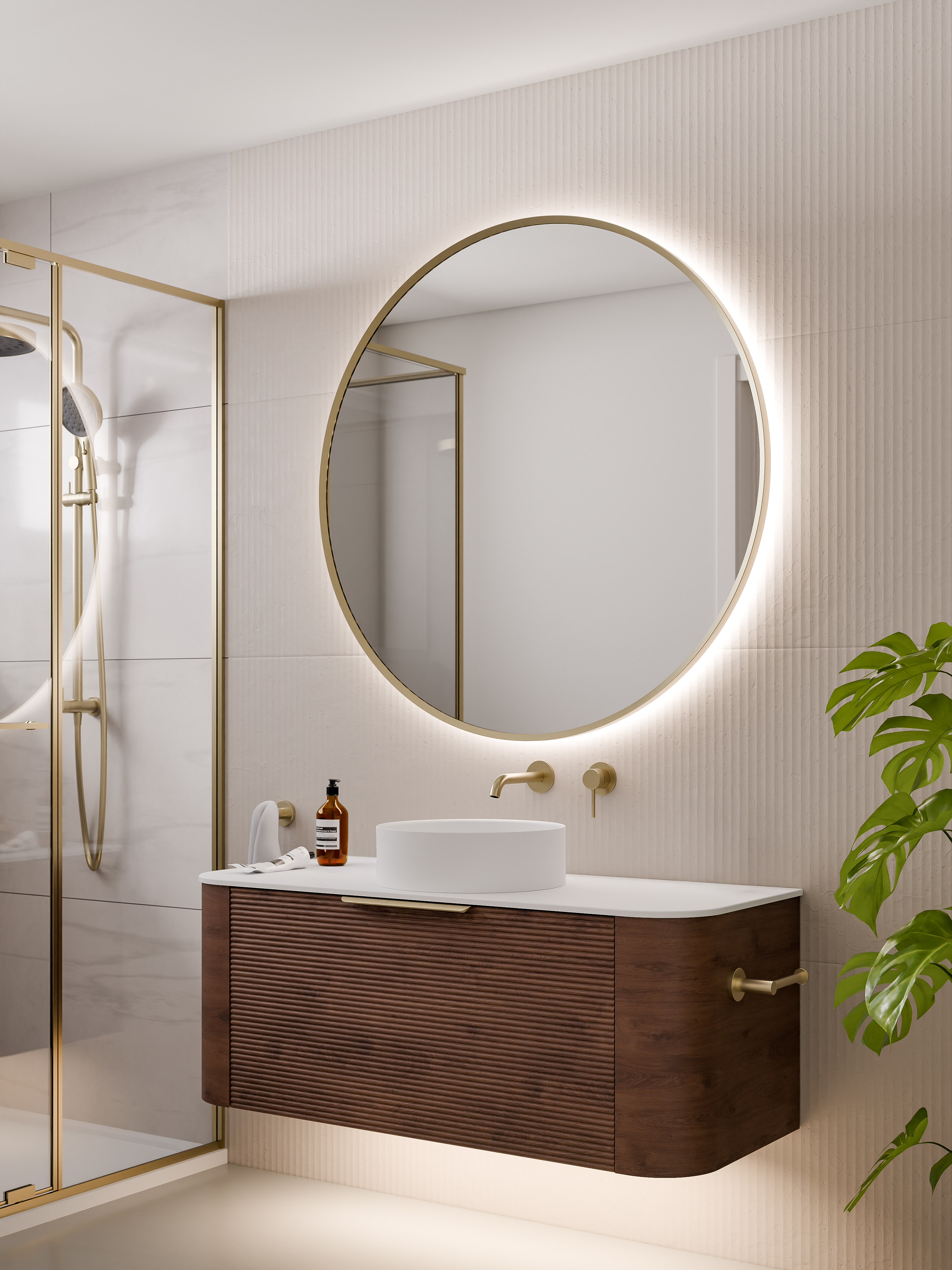 round-framed-led-mirror-in-brushed-brass-with-curved-vanity