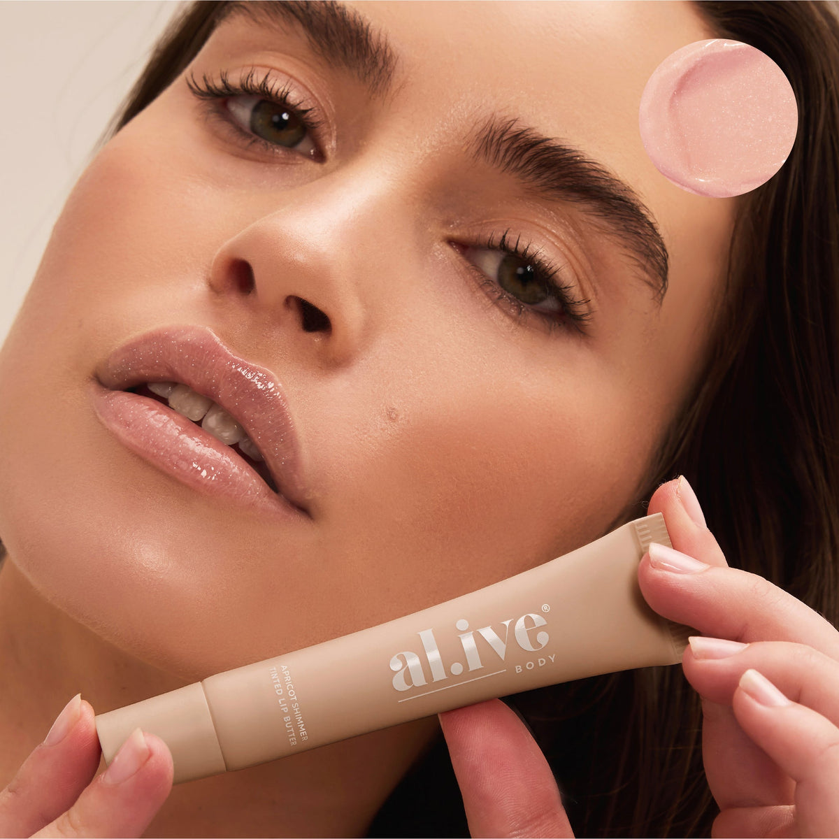 al.ive body Tinted Lip Butter Apricot Shimmer - lifestyle shot