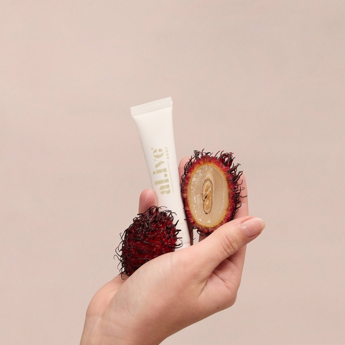 al.ive body Tinted Lip Butter Lychee Blush - swatch shot