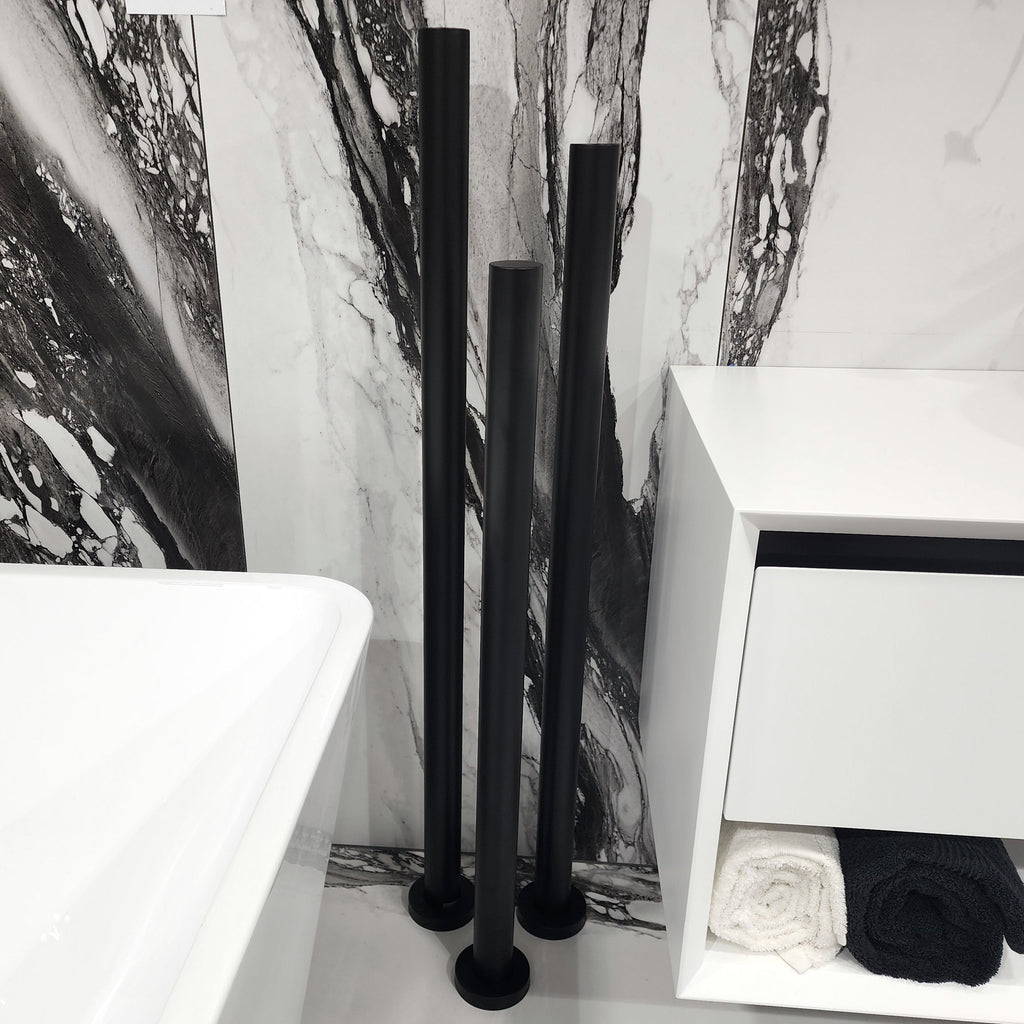 code-freestanding-heated-towel-rail-nz-matte-black-in-tiled-bathroom-setting