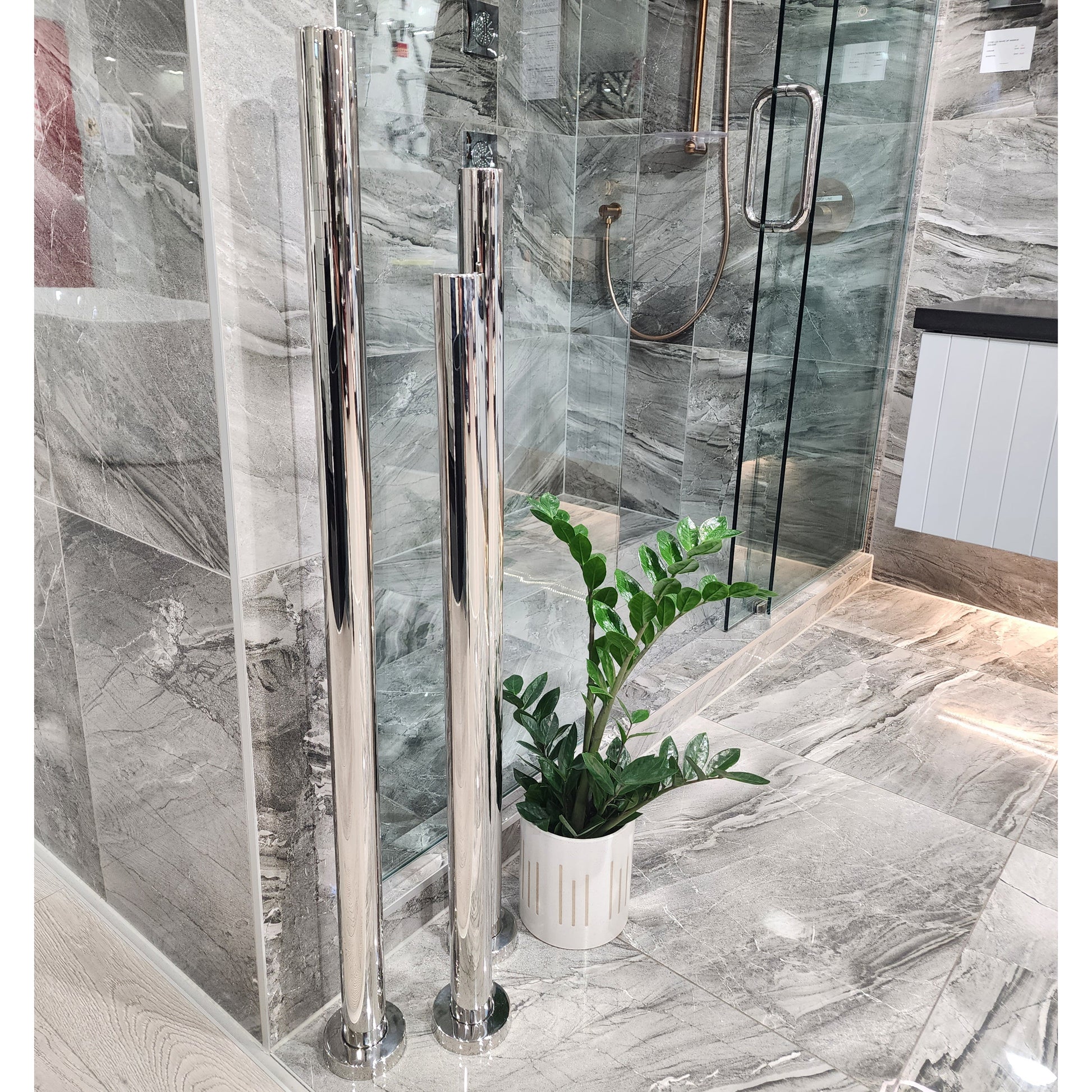 code-freestaing-heated-towel-rail-chrome-in-bathroom-setting