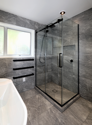 luxury-tiled-shower-with-glass-sliding-door-in-bathroom-setting